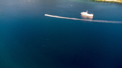 Naklejka na ściany i meble lonely boat in the ocean Croatia