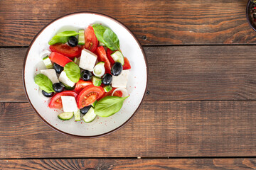 Greek salad feta, olives, vegetables, tomato no meat food organic product meal snack on the table copy space food background rustic. top view keto or paleo diet veggie vegan or vegetarian food
