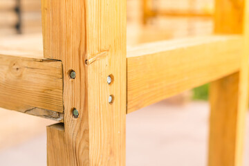 Corner connection of timber beams with bolts