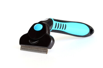 Furminator for combing cats, on a white background. A place for your inscription, design.