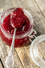 Red rasberries jam in jar.