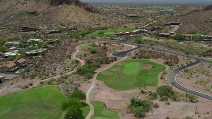 A high definition aerial view of a desert golf course located in the American southwest.