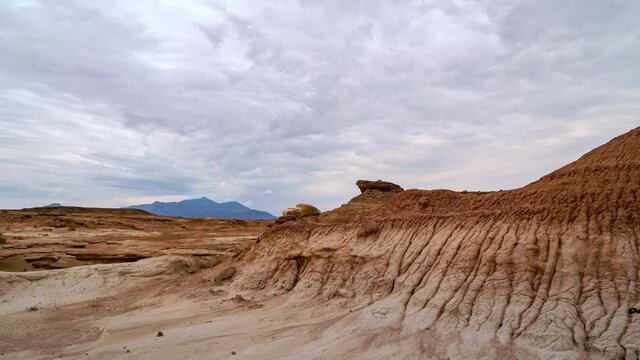 Timelapse of clouds moving over the red desert landscape in Mars Utah looking towards the Henry Mountains.