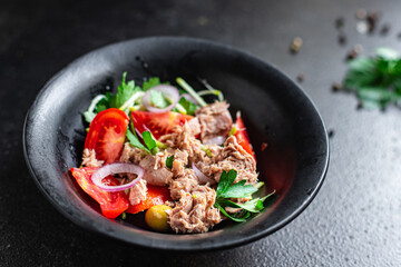 tuna salad vegetable seafood tomato, olives canned tuna fish plate on the table, healthy meal copy space food background top view keto or paleo diet veggie pescetarian diet
