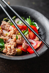 tuna salad vegetable seafood tomato, olives canned tuna fish plate on the table, healthy meal copy space food background top view keto or paleo diet veggie pescetarian diet