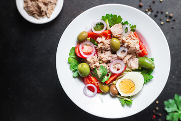 tuna salad vegetable seafood tomato, olives canned tuna fish plate on the table, healthy meal copy space food background top view keto or paleo diet veggie pescetarian diet