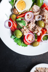 tuna salad vegetable seafood tomato, olives canned tuna fish plate on the table, healthy meal copy space food background top view keto or paleo diet veggie pescetarian diet