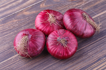 red onions on rustic wood