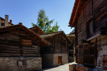 Fototapeta na wymiar Old wooden houses in historic zone of Zermatt, Valais, Swiss Alps, Switzerland