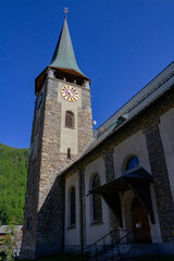 Fototapeta na wymiar View of Zermatt church with clock tower, Valais, Swiss Alps, Switzerland
