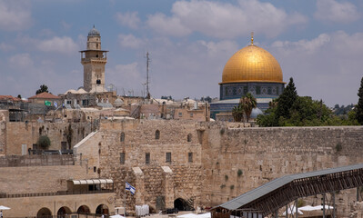 Western Wall, a part of ancient Second Jewish Temple, the Old City of Jerusalem. Islamic shrine the Dome of the Rock on Temple Mount. UNESCO World Heritage Site, Jerusalem's most recognizable landmark