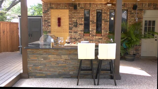 New and modern outdoor kitchen on a sunny summer evening, dinner preparation