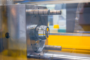 Mold plates - part of automatic injection molding machine at exhibition, trade show. Manufacturing, production, technology concept