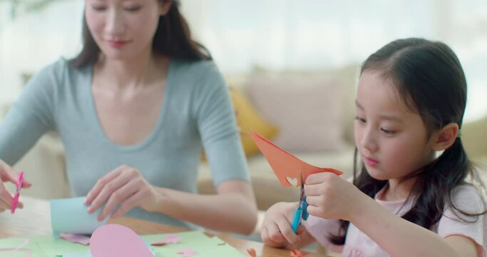 Happy mother and daughter making cards at home,4K