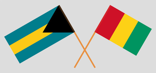 Crossed flags of the Bahamas and Guinea. Official colors. Correct proportion
