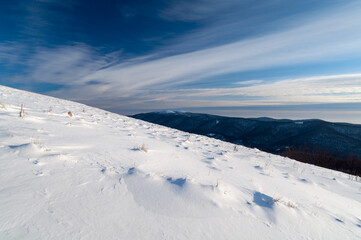 Obraz premium Bieszczady in winter seen from the top of Polonina Wetlinska, the Bieszczady Mountains, the Carpathians, Wielka Rawka