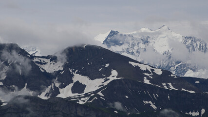 Fototapeta na wymiar Mountains Schwarzhorn and Schreckhorn seen from Mount Brienzer Rothorn.