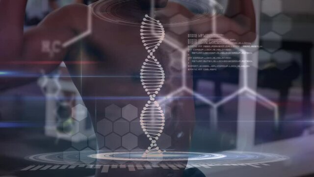 Animation of dna strand spinning and data processing over strong man exercising