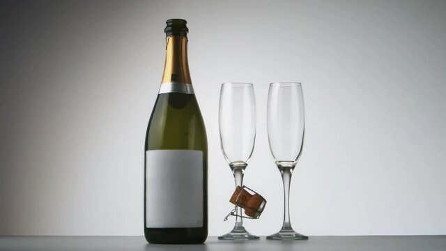 Animation of burning leyer showing champagne bottle and glasses on white background