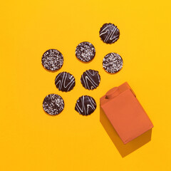 Chocolate cookies and plastic packaging. Minimal art. Holidays time, winter christmas celebration, diet, calorie, sweet shop concept. Flat lay  art