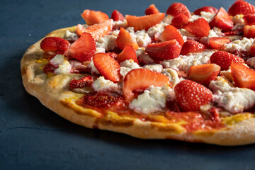 Strawberry and banana pizza with ricotta cheese and mango sauce.