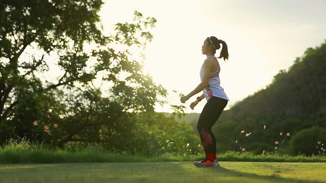 woman doing squats to warm up during exercises in the morning