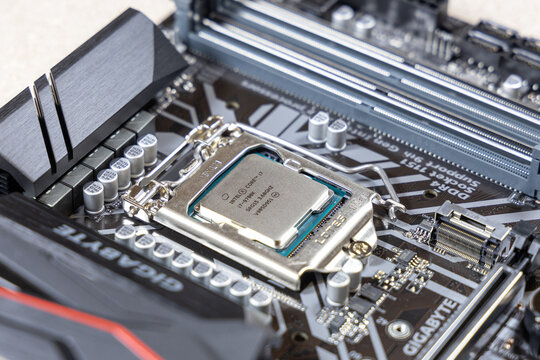 Close-up of an Intel i7-9700K processor installed in socket 1151 on a Gigabyte motherboard. Assembly and upgrade desktop PC. Russia, Moscow - May 16, 2020