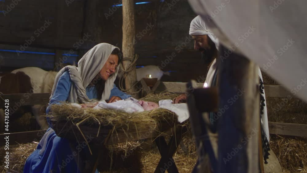 Wall mural mary and joseph with baby jesus in barn nativity