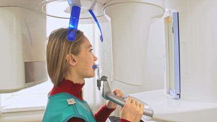 Doctor to take a image 3d scanner tomography of teeth and jaw in modern laboratory dental clinic....