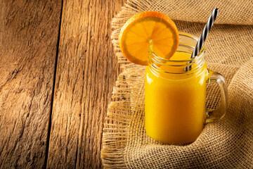 Glass with orange juice on the table. © WS Studio