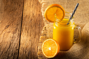 Glass with orange juice on the table. © WS Studio