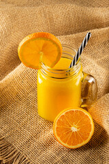 Glass with orange juice on the table. © WS Studio