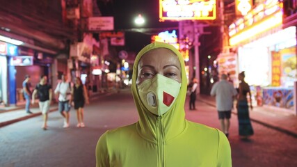 Woman close up look caucasian at Pattaya Walking Street with wearing protective medical mask. Lockdown quarantine isolation. Health virus protection coronavirus epidemic sars-cov-2 covid-19 2019-ncov.