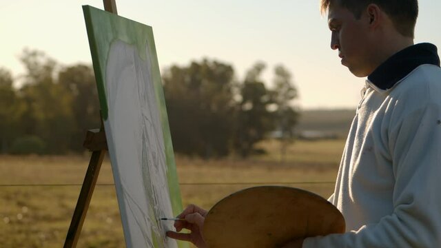 Medium shot of a man painting a horse outdoor