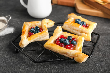 Tray with danish pastry on dark background