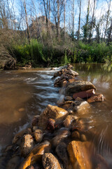 creek in the foreground of mountains in a valley