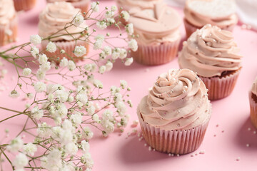 Tasty wedding cupcakes on color background