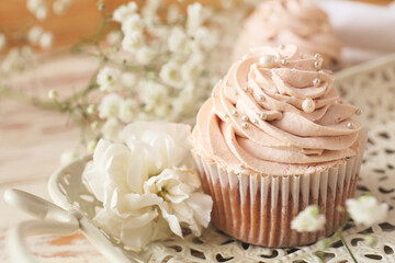 Tray with tasty wedding cupcake, closeup