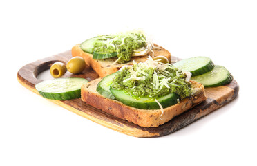 Tasty toasts with pesto sauce, cucumber and olives on white background