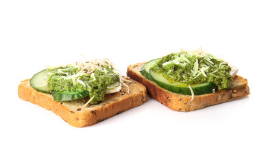 Tasty toasts with pesto sauce on white background