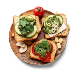 Tasty toasts with pesto sauce and garlic on white background