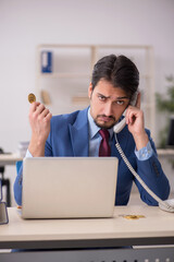 Young man earning money via Internet in cryptocurrency concept