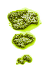 Smears of tasty pesto sauce on white background