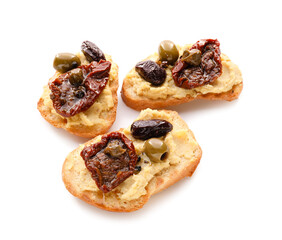 Tasty bruschettas with sun-dried tomatoes and hummus on white background