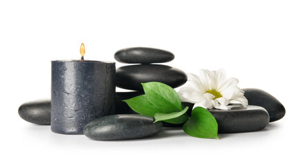 Fototapeta na wymiar Composition with burning candle, chamomile flower with leaves and spa stones on white background