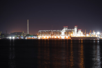 Fototapeta na wymiar View of illuminated harbor at night