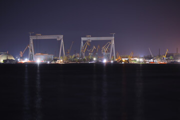 Fototapeta na wymiar View of illuminated harbor at night