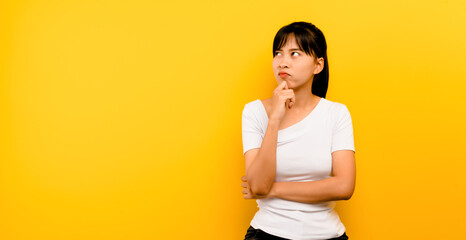 creative concept Close-up of an Asian woman amazing woman looking up free space deep thinking...