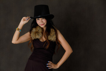 Joyful fancy woman in black dress and hat