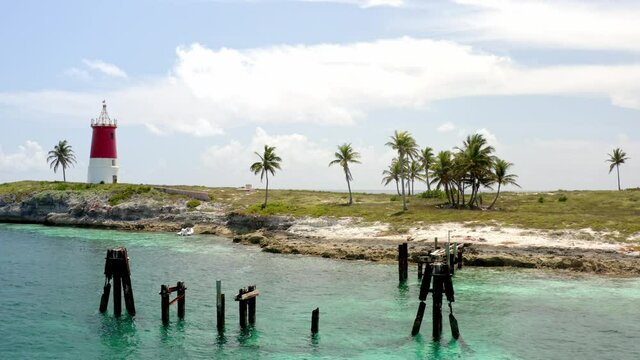 British Stone Tower Of Hole In The Wall Lighthouse In Abaco National Park In Abaco Island, Bahamas. aerial